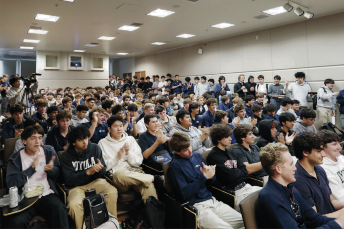 STUDENTS WATCH the critical conversation panel in Otero Hall