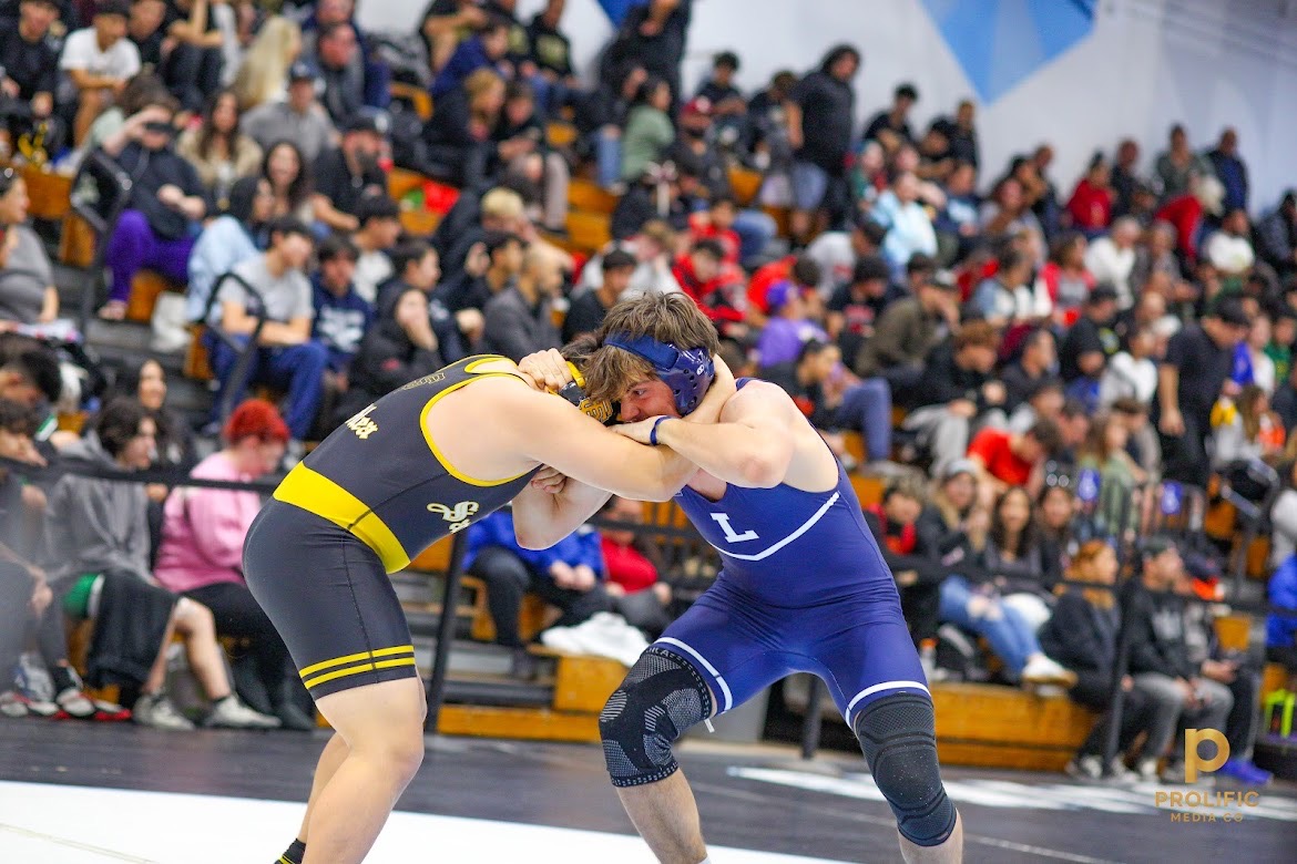 RONAN '27 GRAPPLES with opponent at his wrestling